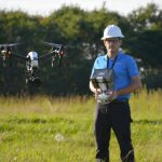 Instructor Alex flying a drone