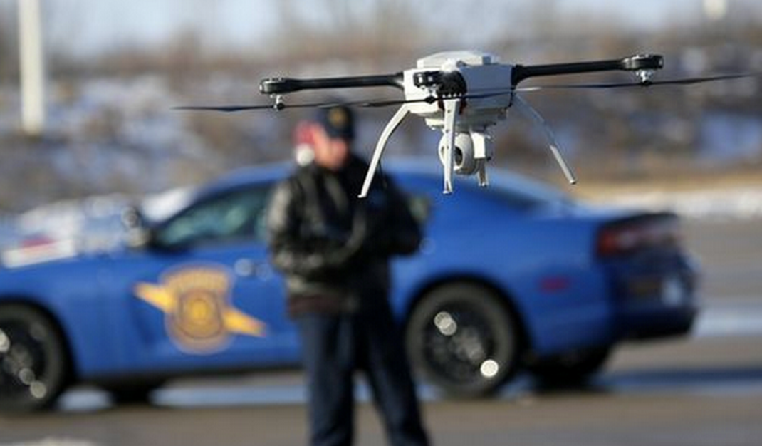 Photo of policeman using drone