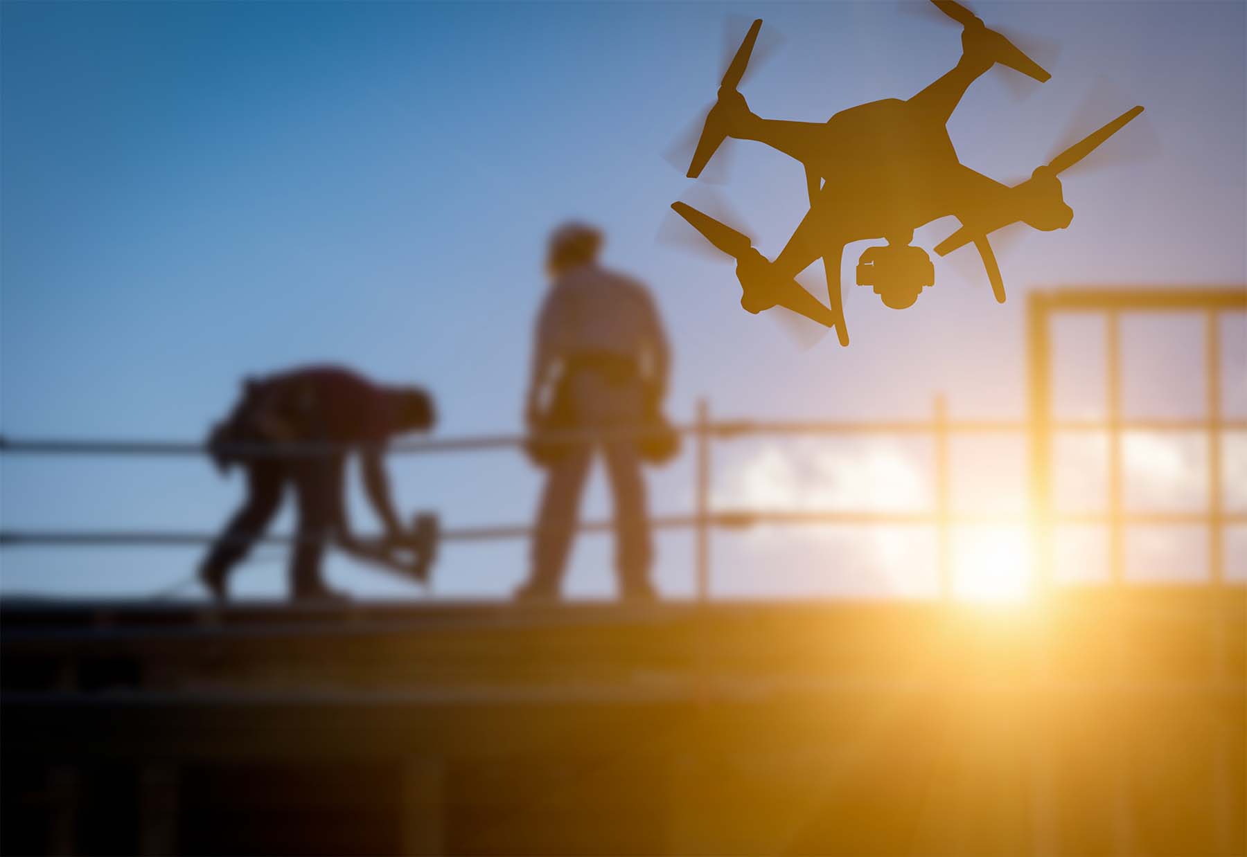 Photo of drone flying near workers