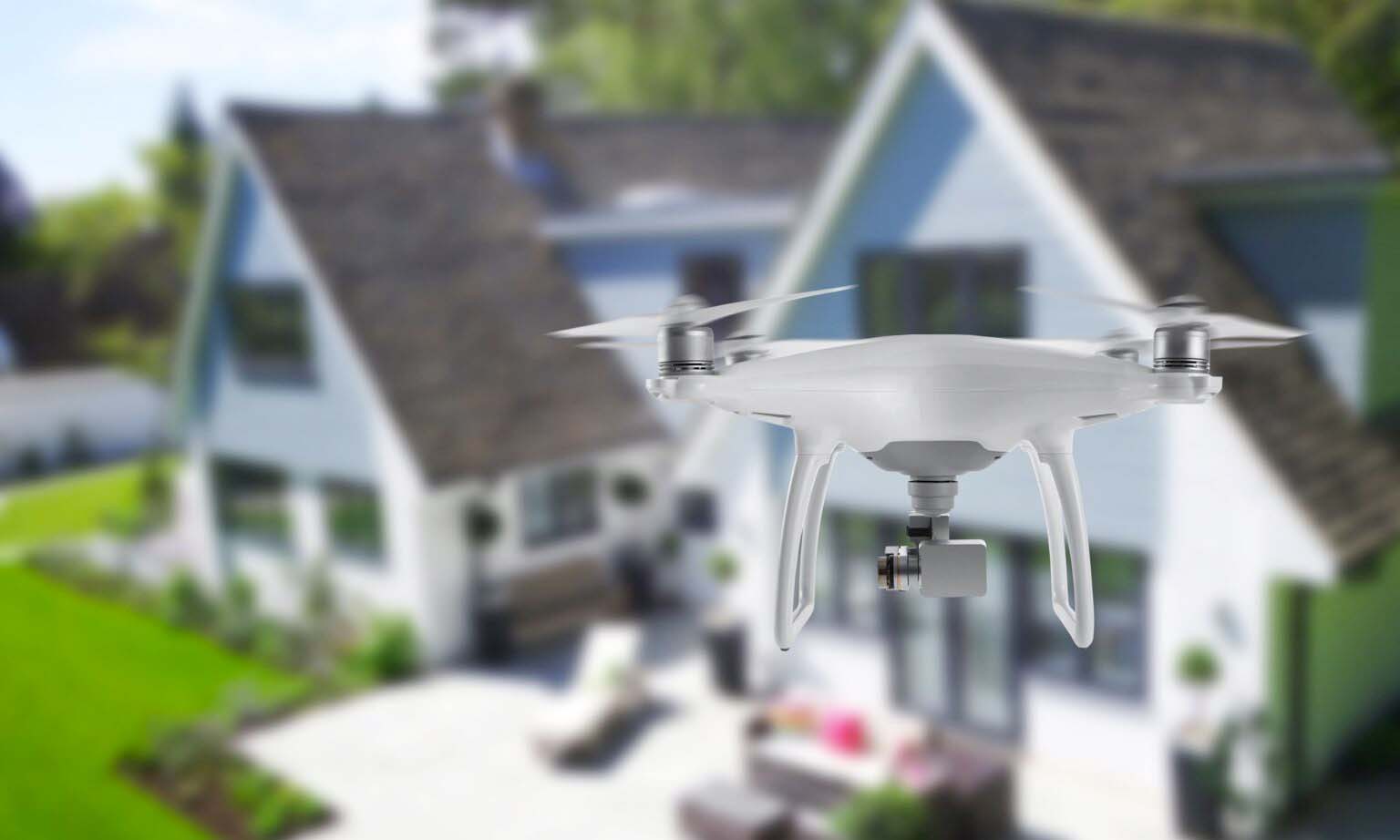 Photo of drone by homes