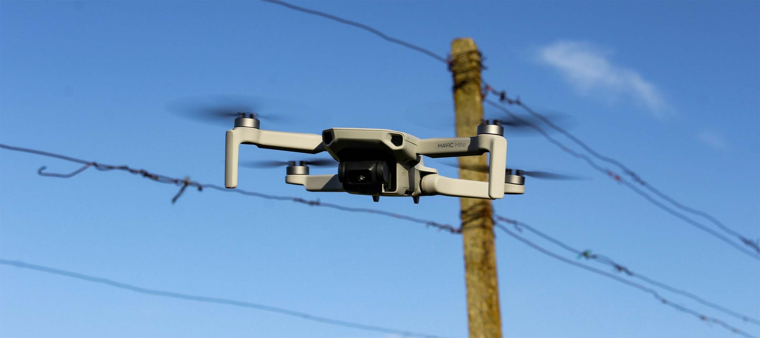 Image of flying drone near powerlines